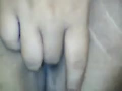 A close-up of my white, lustful Filipina wife stroking her curly twat